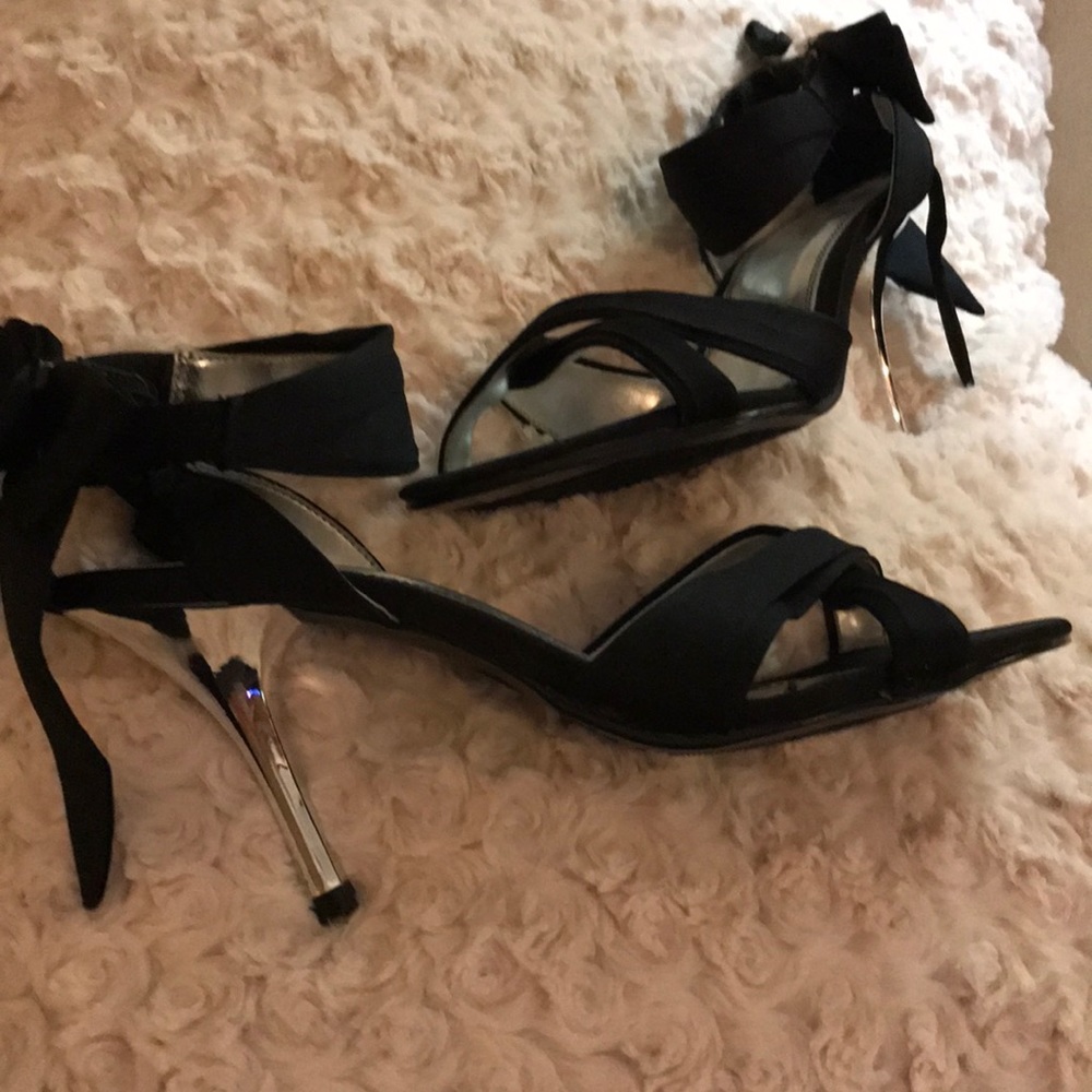 Black Pumps with Bow decoration on heel.